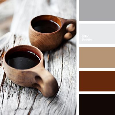 two coffee mugs sitting next to each other on top of a wooden table with color swatches