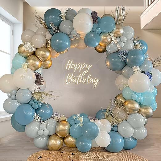 a happy birthday balloon arch with blue, gold and white balloons in the shape of a wreath