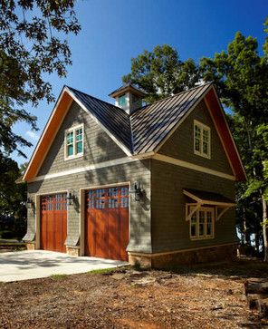 this is an image of a garage with two doors on the front and second story