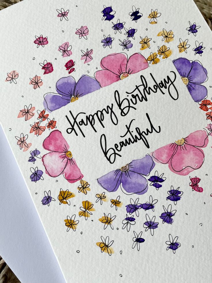 a happy birthday card with watercolor flowers and the words, happy birthday beautiful on it