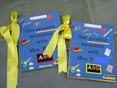 two children's books with yellow ribbons tied to them on the ground next to each other