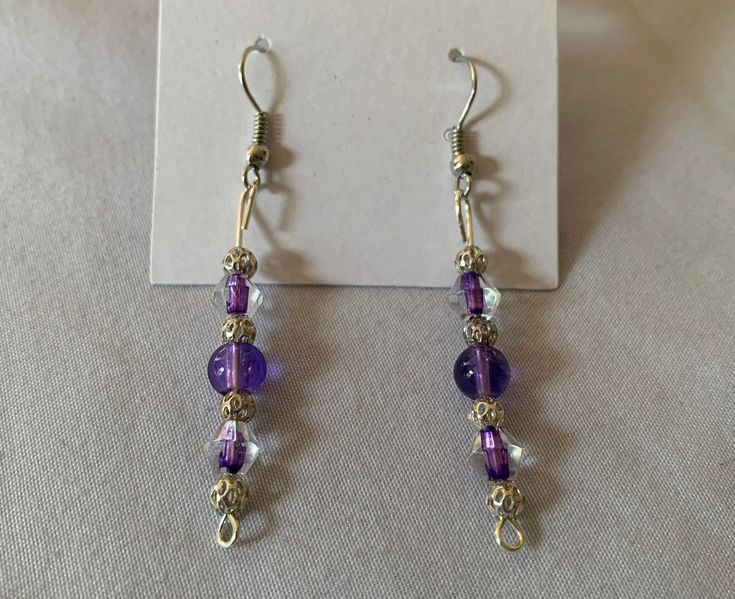 purple glass bead and silver bead dangle earrings Purple Metal Drop Earrings, Purple Round Metal Earrings, Purple Metal Dangle Earrings, Purple Dangle Metal Earrings, Elegant Lavender Beaded Earrings With Dangling Beads, Silver Drop Earrings With Silver Beads, Elegant Lavender Beaded Drop Earrings, Nickel-free Purple Beaded Round Earrings, Silver Czech Glass Beaded Earrings