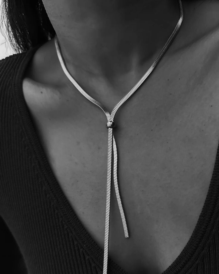 Silver Adjustable Lariat Choker Necklace, Silver Lariat Choker Necklace With Adjustable Length, Adjustable Silver Lariat Choker, Elegant Snake Chain Choker With Adjustable Chain, Modern Herringbone Necklace For Formal Occasions, Minimalist Snake Chain Necklace For Formal Occasions, Chic Metal Lariat Jewelry, Elegant Metal Herringbone Choker Necklace, Silver Lariat Choker Necklace With Clavicle Chain