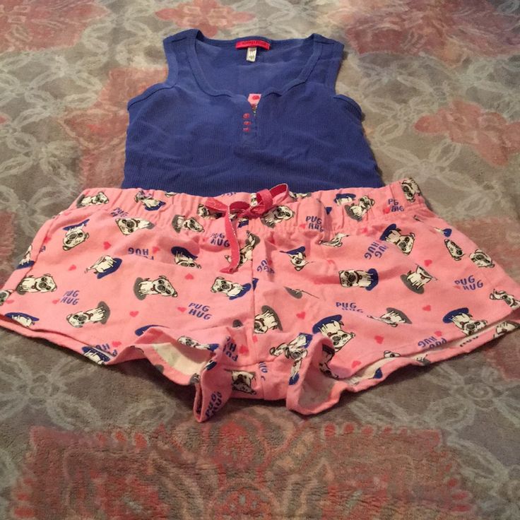 Brand New And Never Worn. Sleep Riot Tank And Shorts Sleep Set. Blue Tank With Buttons. Pink Shorts With Pug Hug Print. No Rips Or Stains. Smoke Free And Pet Free Home. Fun Blue Sleepwear, Playful Cotton Pajama Shorts For Sleep, Pink Cotton Pajama Shorts For Bedtime, Playful Sleeveless Cotton Sleepwear, Blue Fun Sleepwear, Blue Fun Sleepwear For Sleepover, Playful Pink Pajama Shorts For Pajama Party, Fun Blue Sleepwear For Sleepover, Cute Pink Cotton Pajama Shorts