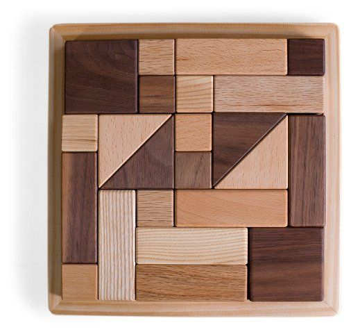 the wooden puzzle is made up of different types of shapes and sizes, including squares