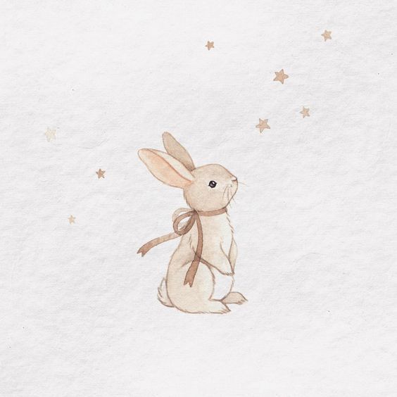 a drawing of a rabbit sitting in the snow with stars on it's back