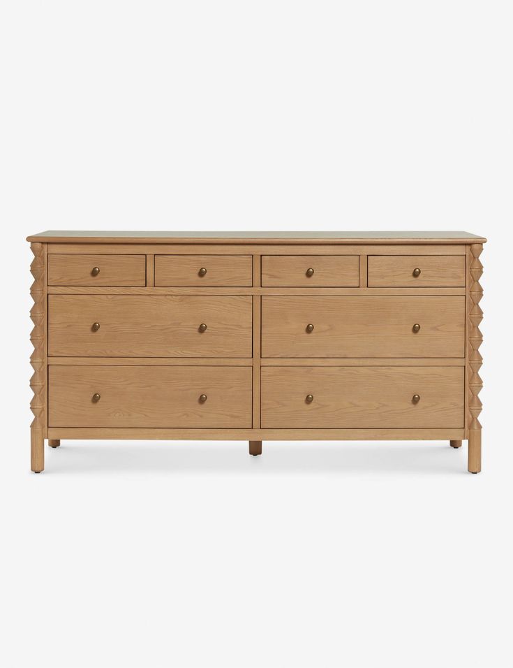 a wooden dresser with four drawers and one drawer on the bottom, in front of a white background