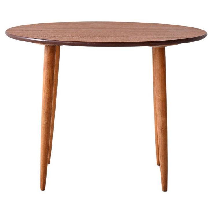 a small wooden table with two legs and a round top on an isolated white background