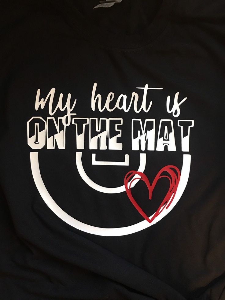 My heart is on the mat wrestling mom t shirt. Made to order, completely customizable! Send a message with your order for specific t shirt or design colors. If you don't request specific colors, you will receive the black t shirt as pictured. You may also add a name to the back of the shirt. We use Unisex Gildan and Jerzees 100 percent cotton (or 50 percent cotton/ 50 percent polyester). However other styles are available upon request (ladies fit, V neck, long sleeve, etc.) If you have any questi Wrestling Mom Shirts, Wrestling Shirts, Wrestling Mom, Bleach T Shirts, Sports Mom, Sister Love, A Name, Graphic Tees Women, Black T Shirt