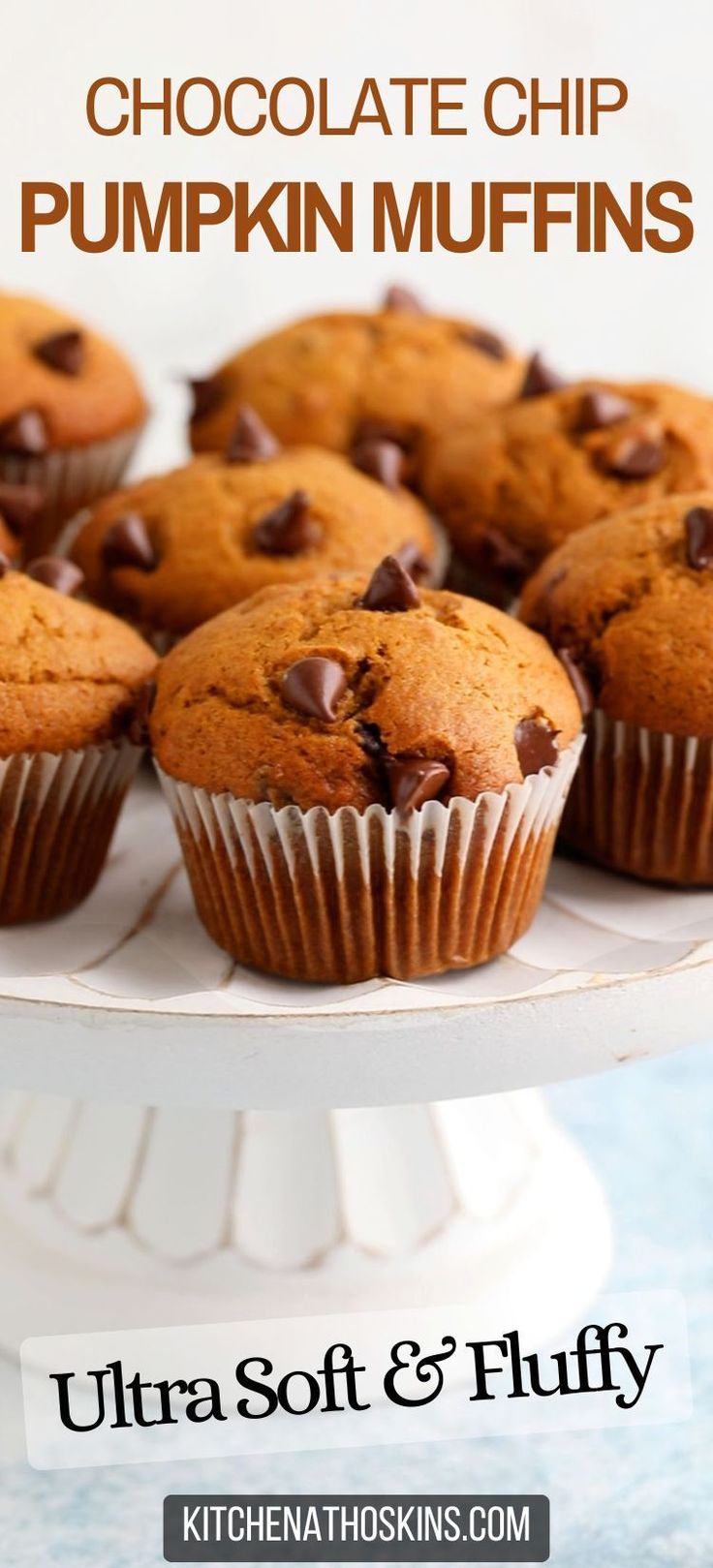 chocolate chip pumpkin muffins on a white cake platter with text overlay