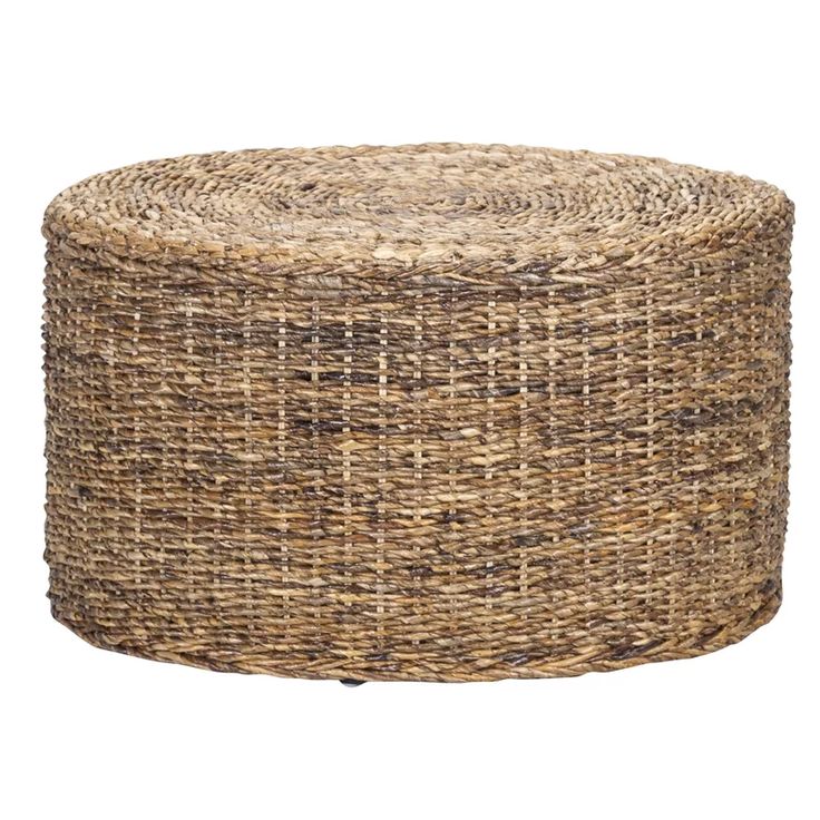 a round wicker ottoman on white background