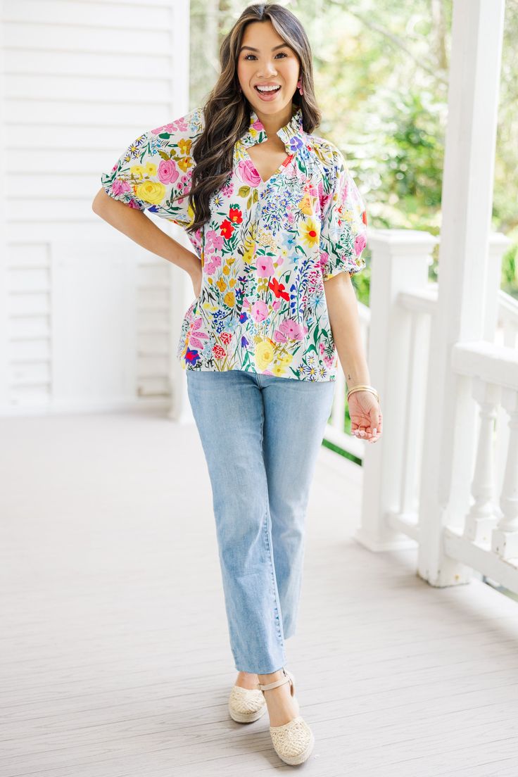 This floral blouse will have you ready for any summer occasion! That print and those colors are so pretty and we know you love the little ruffled detailing and bubble sleeves. Plus, who doesn't love a blouse that can be styled with sandals, sneakers, or wedges?! V-neckline Short bubble sleeves Floral print No stretch Cindy is wearing the small. Trendy Summer Blouse With Flutter Sleeves, Spring Floral Print Tops With Flutter Sleeve, Summer Top With Floral Print And Ruffle Sleeves, Summer Tops With Ruffle Sleeves For Day Out, Ruffle Sleeve Tops For Summer Day Out, Spring Vacation Ruffle Sleeve Tops, Spring Vacation Tops With Ruffle Sleeves, Multicolor Flowy Blouse With Flutter Sleeves, Summer Feminine Blouse With Ruffle Sleeves