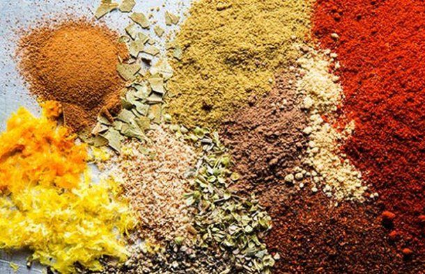 various spices and seasonings on a table with the words click here for the recipe