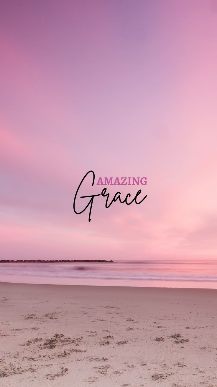 the words amazing grace are written in black on a pink and purple sky over a beach