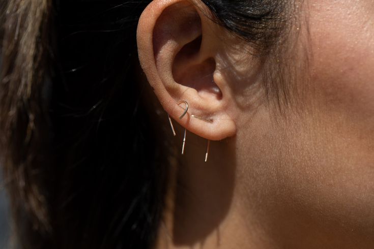 Description Unique connected earring for a double piercing. Sold individually. Details Measurements: 1.75 cm long in the back, 0.75 cm across *Measurements are approximate. Since each piece is handmade, there will be some slight variations. Handmade in Austin, TX. Dainty Ear Cuff For Everyday, Dainty Everyday Wrap Earrings, Pierced Dangle Ear Cuff For Everyday, Everyday Pierced Dangle Ear Cuff, Everyday Dangle Ear Cuff, Adjustable Pierced Threader Earrings For Everyday, Everyday Dangle Cartilage Earrings, Dainty Pierced Ear Climbers For Everyday, Dainty Everyday Pierced Ear Climbers