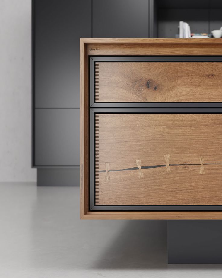 a wooden cabinet with two drawers in the middle