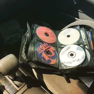 cd's are sitting in the back seat of a car