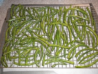 green beans are being cooked on a grill in the kitchen, and they're ready to be grilled