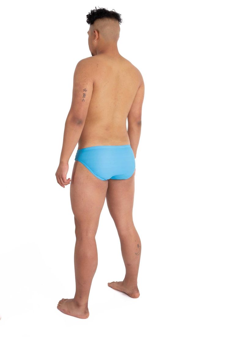 Whether it’s Bermuda, The Bahamas, or the Maldives, get into the sunny beach vibes with our sky blue swim briefs. In true Kapow fashion we’ve spiked ‘em with neon orange and a slash of leopard print to get all eyes on you. Featuring a classic cut and low-rise waist, they’ll take you from the ocean to the swim-up wet bar in tropical style. Description: Men’s Sky Blue Swim Briefs With Neon Orange And Leopard Print Highlight Panels Durable stretch fabric with a front liner for sports comfort and a Blue Training Bottoms, Nylon Sports Bottoms With Built-in Padding, Padded Nylon Sports Bottoms, Blue Functional Training Bottoms, Functional Blue Training Bottoms, Fitted Blue Swimwear For Sports Events, Blue Sporty Activewear With Elastic Side Panels, Sporty Blue Activewear With Elastic Side Panels, Functional Moisture-wicking Swimwear For Sports