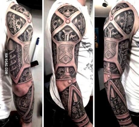 a man's arm is covered in tattoos and has an intricate design on it