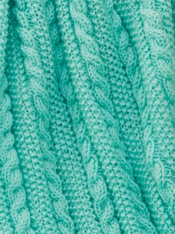 a close up view of the texture of a knitted blanket in aqua green color