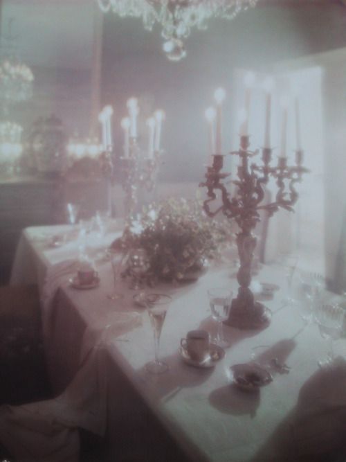 an image of a table setting with candles