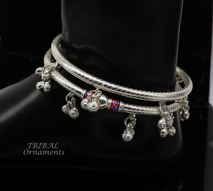 Handmade silver excellent tribal jewellery, women's ankle bracelet foot kada with gorgeous tribal belly dance jewellery from Rajasthan India. top class wedding anniversary brides' personalized gifting jewellery. Metal- silver. Type- anklet/foot kada/ankle kada bracelet. Weight-62.710 grams approx. for pair. Width-4 mm approx. Size-3.2" or 8.2 centimetre inner diameter. Quantity-pair. size -Easily wearable by twisting it for any size. makes excellent gift item for birthdays, mother's day, wedding, anniversary, Christmas day, valentines day, belly dance. Traditional Silver Toe Ring Anklets, Traditional Sterling Silver Anklets With Silver Beads, Traditional Sterling Silver Anklet, Adjustable Silver Anklets For Festive Season, Festive Adjustable Silver Anklets, Festive Silver Adjustable Anklets, Traditional Sterling Silver Anklets For Festive Occasions, Sterling Silver Toe Ring Anklet For Festivals, Traditional Sterling Silver Festive Anklets