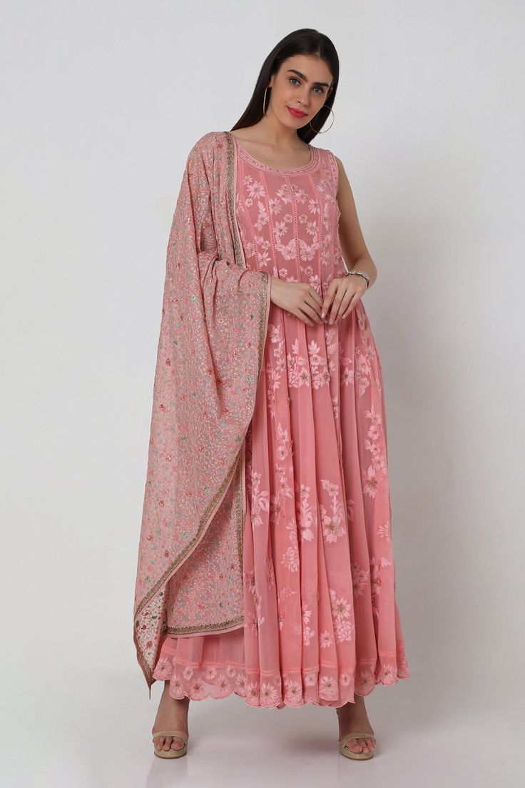 Pink anarkali with mesh of floral motifs, embroidered scallop detail hem and in-seam lace detail. Comes with churidar and georgette dupatta.
Component: 3
Embroidered
Neckline: Round
Sleeve Length: Sleeveless
Fabric: Anarkali and Dupatta: Georgette; Churidar: Power Net
Color: Pink
Tie-up back
 - Aza Fashions Pink Anarkali, Net Embroidery, Embroidered Anarkali, Georgette Dupatta, Indian Gowns Dresses, Indian Gowns, Embroidered Neckline, Pink Tie, Pink Ties