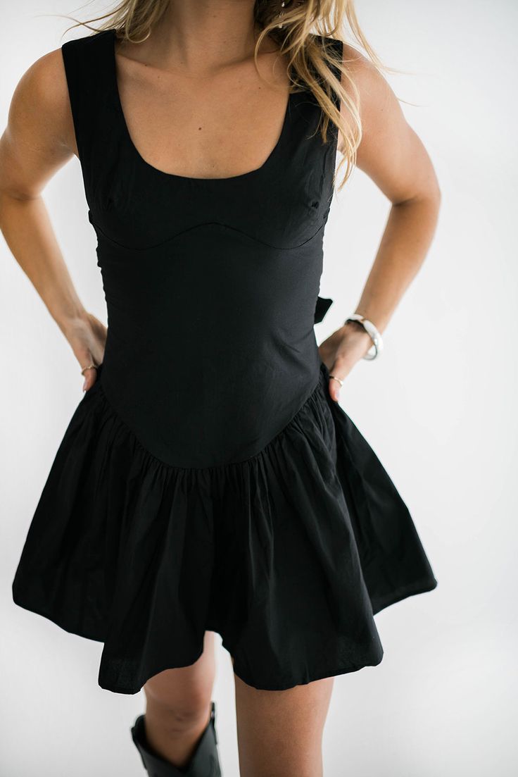 We are in love with our Larisa dress. The square neckline with fitted waist and tie back detail are what makes this dress unlike any other. Then you add the a-line flouncy skirt detail and you have the perfect little black dress. You can wear this dress in every season. Perfect for this time of year with boots and one of our denim jackets. Size Chart Features: square neckline fitted waist top a line flounce bottom tie back zipper closure fabric content: 100% cotton model is wearing a small. Heig Flouncy Skirt, Perfect Little Black Dress, The Square, Denim Jackets, Square Necklines, Tie Backs, Tie Back, Square Neckline, In Love