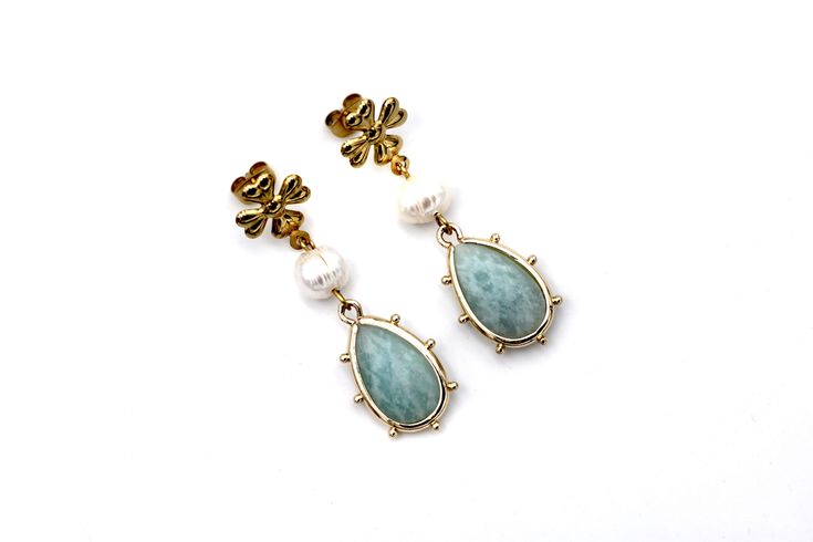 These amazonite earrings have dreamy garden party vibes, just waiting for the perfect dress to pair with them. They feature white fresh water pearl beads paired with gorgeous amazonite teardrop charms. Each earring is topped with a flower-shaped stainless steel post. Please note that each of the amazonite charms are unique and no two are alike. MATERIALS Amazonite Charms Fresh Water Pearl Beads Stainless Steel Ear Posts LENGTH 1 3/4" CARE Direct contact with perfumes and moisture should be avoid Amazonite Earrings, Dreamy Garden, Steel Post, Fresh Water Pearl, Flower Shape, Pearl Beads, Garden Party, Perfect Dress, Fresh Water