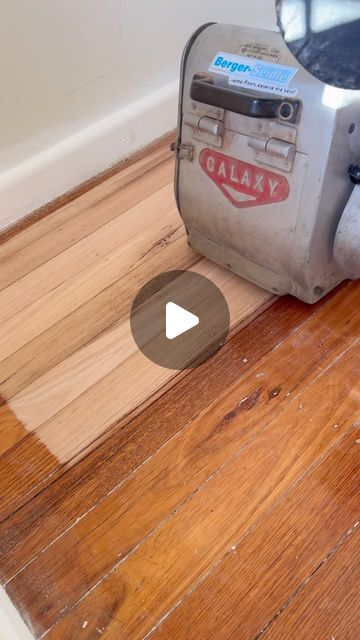 an old blender sitting on top of a wooden floor