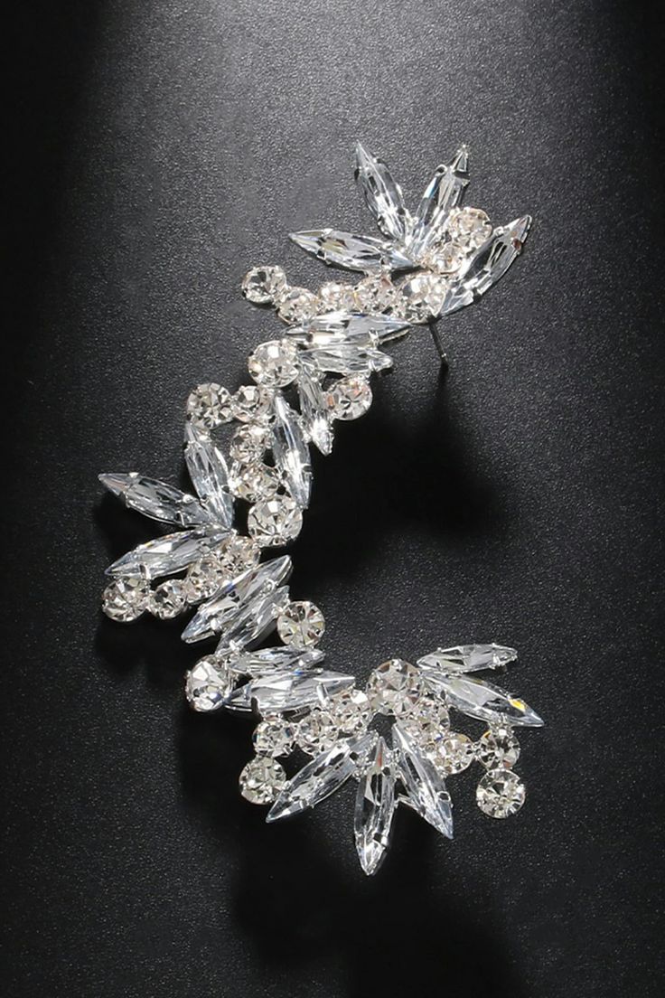 Elevate your style with our Sparkling Rhinestone Floral Ear Clips. These exquisite accessories feature intricate flower designs adorned with glistening water diamonds. The meticulous craftsmanship and attention to detail make these ear clips a symbol of timeless elegance, enhancing your natural charm. The high-quality materials not only add a touch of glamour but also ensure durability. Whether it's a special occasion or a casual day out, these ear clips are the perfect complement to your unique Glistening Water, Ear Clips, Sparkling Water, Women Cargos, Unique Beauty, Floral Designs, Design Process, Natural Fibers, A Symbol