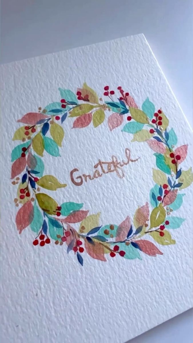 a card with the word grateful written on it, surrounded by watercolor leaves and berries