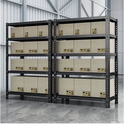 two shelving units with boxes stacked on top of each other in an industrial warehouse