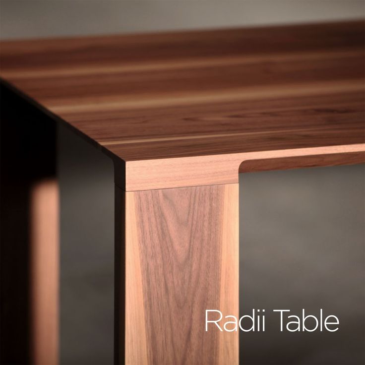 a close up of a wooden table with the name radii table on it