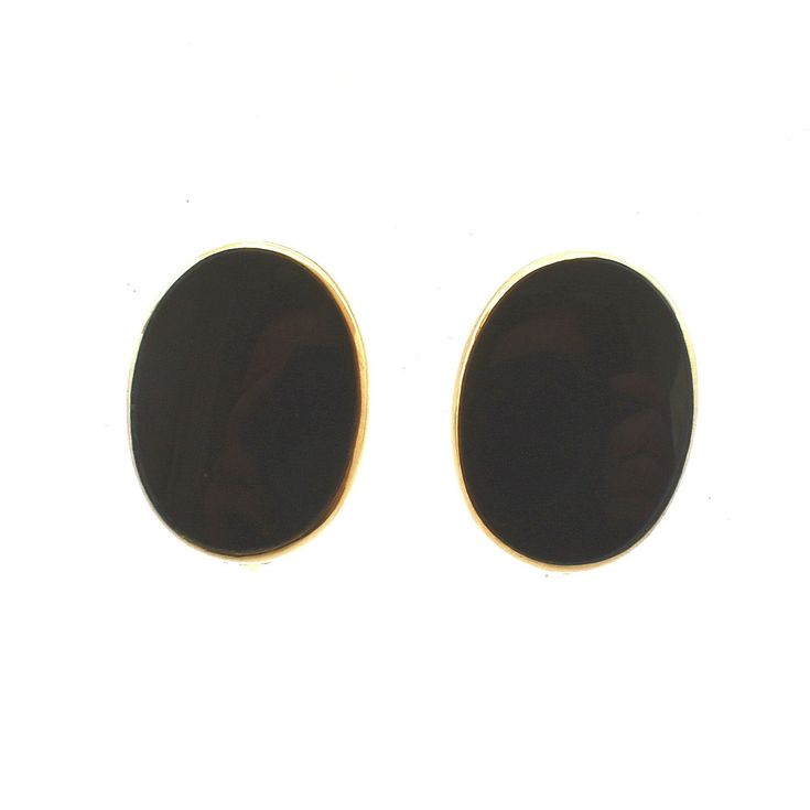 Surprise your special lady (or treat yourself) with these screw-on earrings--no pierced ears required! These classy 14 karat solid yellow gold earrings are bezel-set with oval onyx cabochons, each measuring 15.83 millimeters long by 11.63 millimeters wide, and each weighing an estimated 3.36 carats. The clasps match and each is stamped 14K. Each earring measures 16.54 millimeters (just over 5/8 inch) long by 12.5 millimeters (just under 1/2 inch) wide. They are stamped 14K on the screw heads, an Black Oval Earrings For Anniversary, Classic Black Oval Earrings, Classic Oval Clip-on Earrings With Polished Finish, Black Oval Earrings For Formal Occasions, Classic Black Clip-on Earrings For Formal Occasions, Vintage Diamond Earrings, Lapis Lazuli Earrings, Yellow Gold Earrings, All Gems