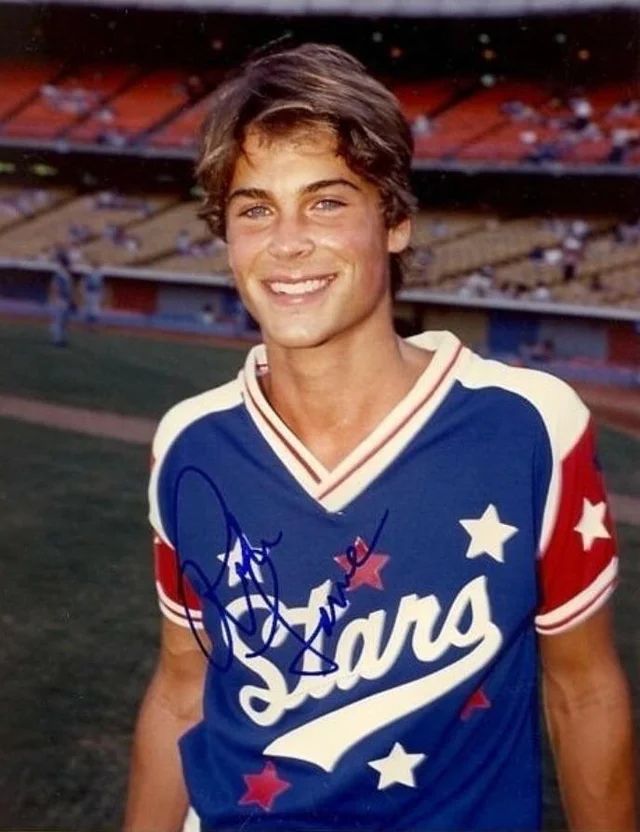 an autographed baseball player is smiling for the camera