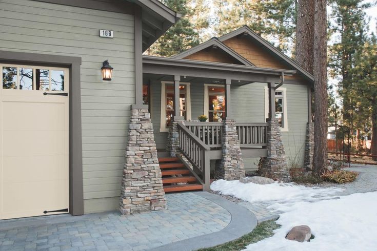 a house with stone steps leading up to the front door