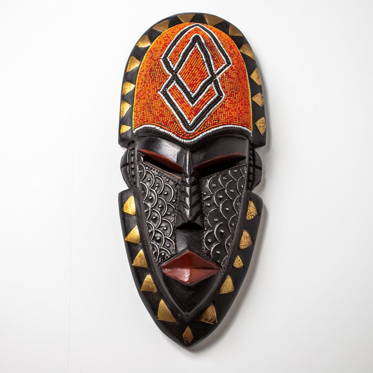 An authentic themed West African tribal masks. These masks are hand carved out of Sese wood and then hand painted by our Ghanaian artisan. It features various paintings and an elongated shapes. Legend has it, African mask are used to scare off Bad Energy. The masks Also signifies Authenticity and Power. * Authentic African Art * Made out of Sese Wood  * Hand Carved * Hand Panted * West African Mask (Ghana) It is used as a home decorative item, or as a wall hanging. This will make a great gift and will stand out in any room. Mask may look bright due to natural light. Kindly note, due to mask being handmade, please expect slight difference in sizes, color and raw material texture. Thank you. CARE; Do not submerge/soak in water. If necessary, use a damp cloth to wipe the mask clean. Made in G Bear Meaning, Animal Characteristics, Traditional Masks, Afrikaanse Kunst, African Sculptures, African Mask, Africa Art, Masks Art, Clay Mask