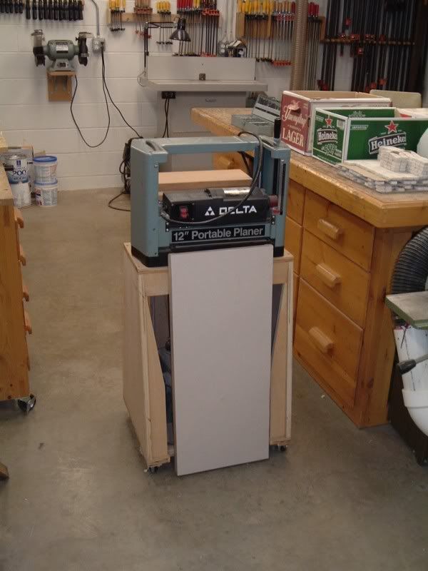 a workbench in a garage with tools on it