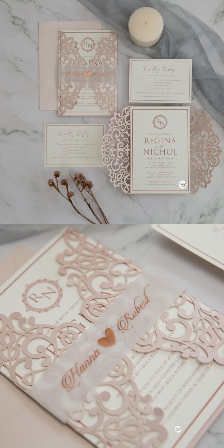 the wedding stationery is laid out on a marble table with candles and some flowers