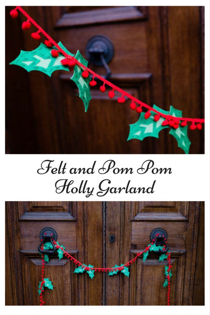 holly garland and pom pom holly garland hanging on the front door for christmas