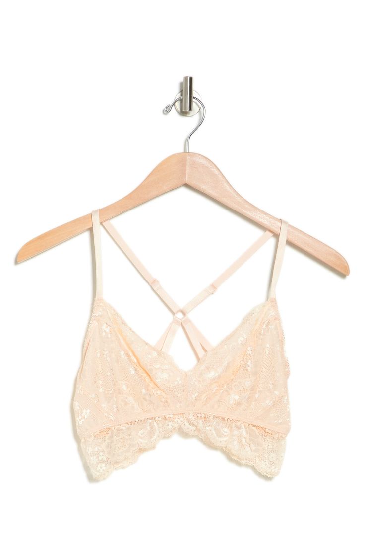 Delicate lace plays up the romantic charm on this soft cup bralette that features a strappy cross-back that will support you completely. 90% nylon, 10% spandex
 Machine wash cold, lay flat to dry Imported Spring Lace Beige Bra, Spring Beige Lace Bra, Spring Lace Bra With Delicate Straps, Feminine Beige Bra For Spring, Delicate Lace Bra For Spring, Feminine Cream Bra For Spring, Cream Lace Bra With Lace Trim, Feminine Lace Bra For Spring, Feminine Spring Lace Bra