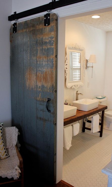 an open door leading to a bathroom with sink and toilet