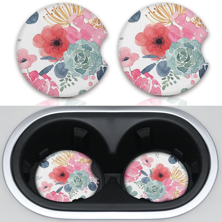 two flowered coasters are sitting on top of each other