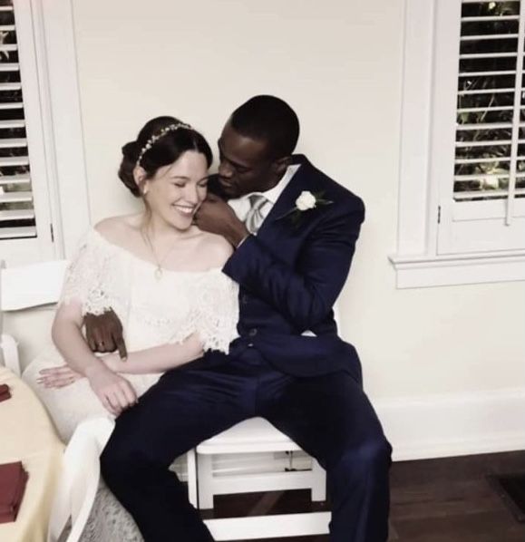 a bride and groom posing for a photo