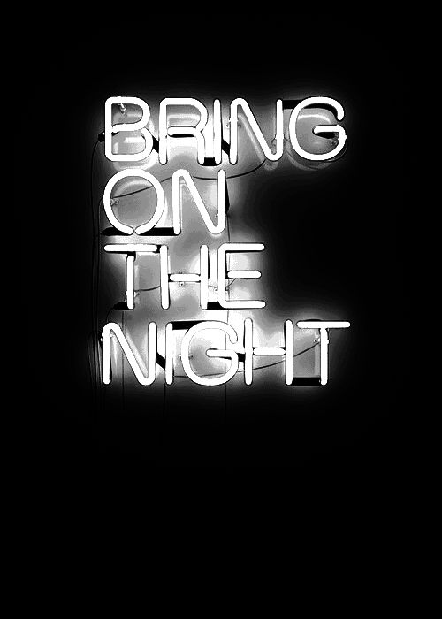 a neon sign that says bring on the night in white letters against a black background