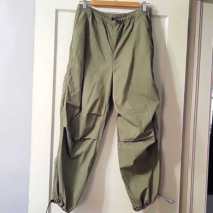 Army Green Parachute Pants. Drawstring Waistband And Ankle. Cotton And Polyester. Pleats At The Knees. Size Is Xs But Fits Like 4-6. H&m Casual Tapered Leg Pants, Trendy H&m Spring Pants, Green Tapered Leg Parachute Pants For Spring, H&m Pants With Elastic Waistband, H&m Trousers With Elastic Waistband, H&m Casual Ankle-length Pants, H&m Tapered Leg Bottoms For Spring, H&m Cotton Pants With Elastic Waistband, H&m Tapered Leg Spring Bottoms