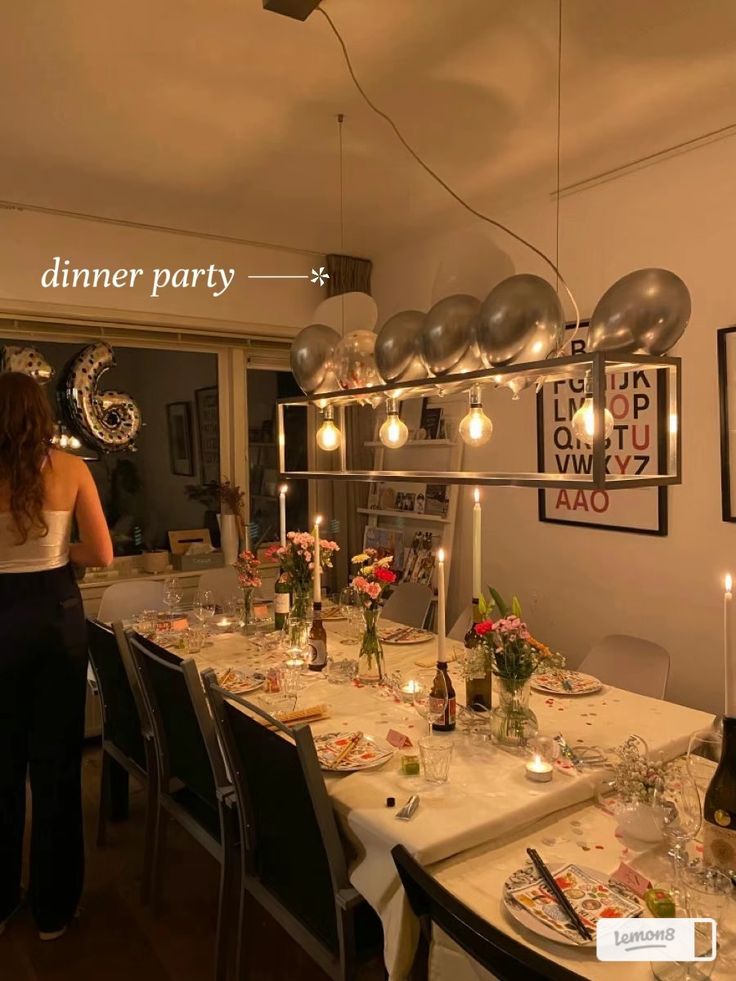 a woman standing in front of a dining room table