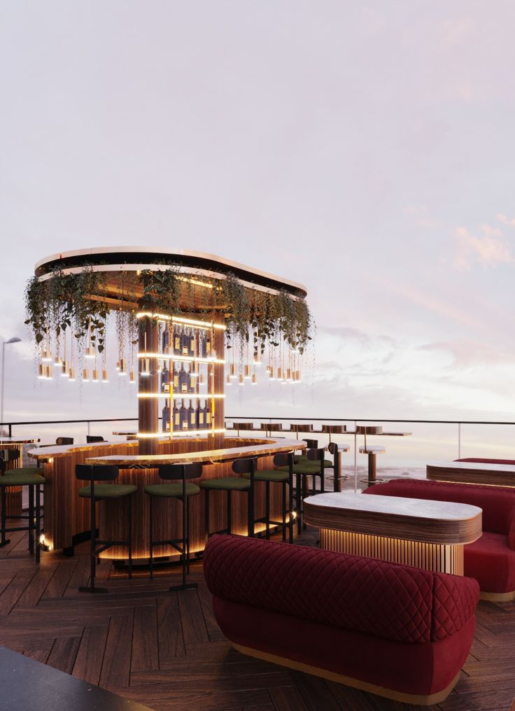 an outdoor bar and seating area on the deck of a cruise ship at dusk with lights hanging from the ceiling